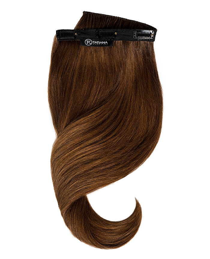 A studio picture of a brunette hair extension clip with Tatiana Karelina tag.