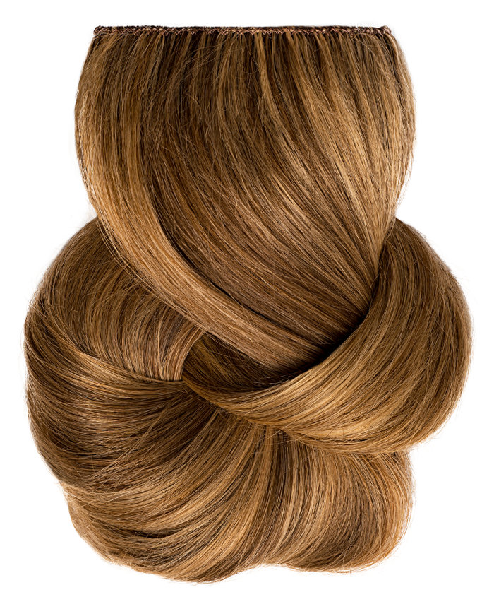 Clip In Extensions | A studio image of a loosely braided light brunette clip on extension.