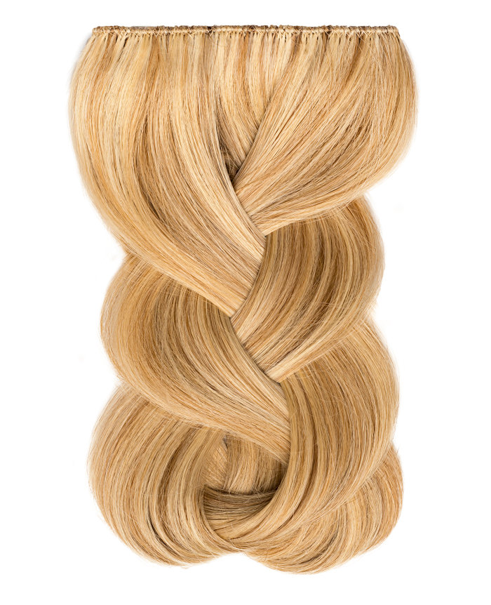 Clip In Extensions | A studio image of a loosely braided honey blonde clip on extension.