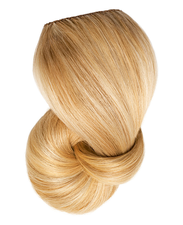 Clip In Extensions | A studio image of a honey blonde clip on extension.
