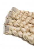 Clip in Extensions | A close-up of four braided light blond hair extensions side to side.